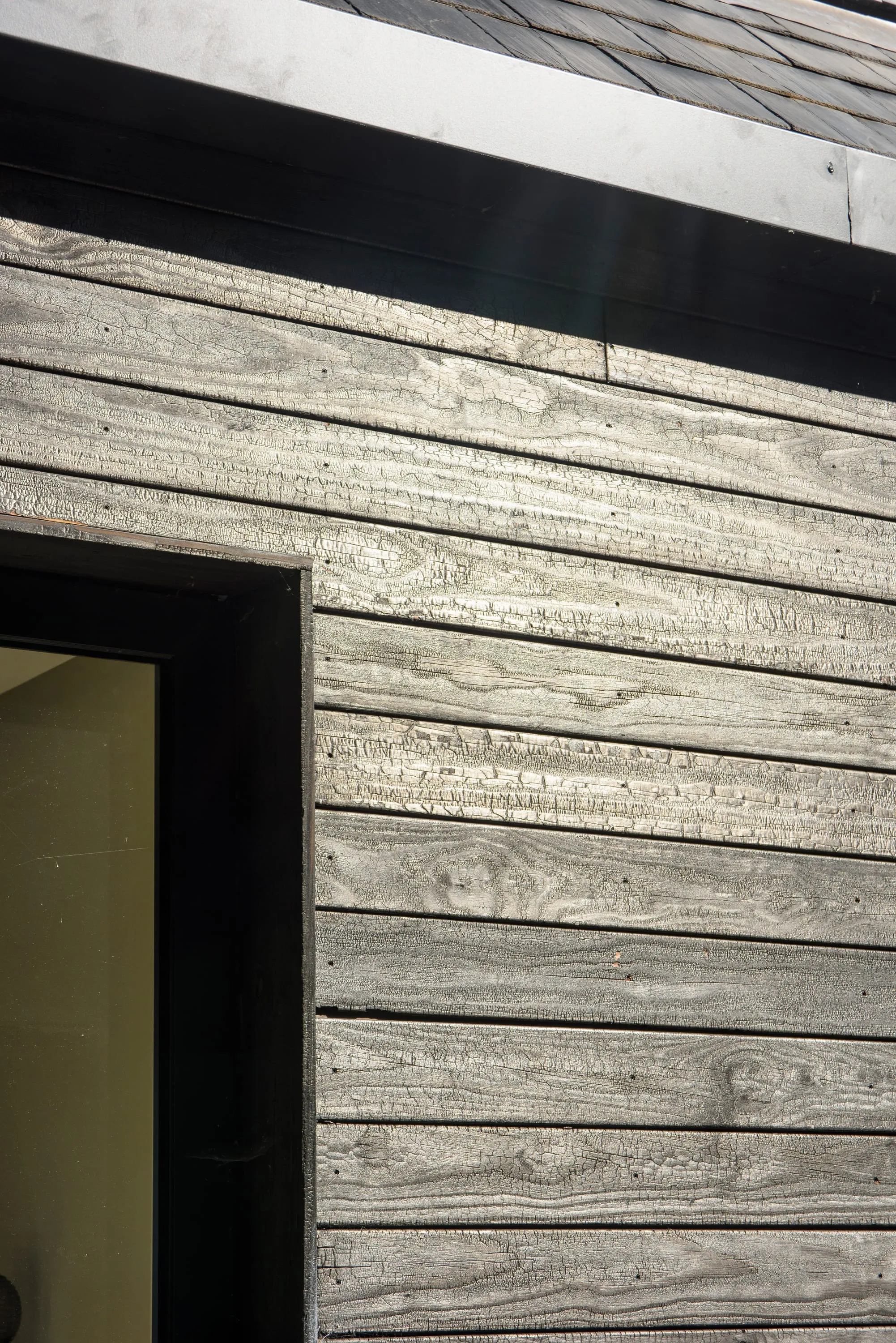 Detail of horizontal scorched timber boards