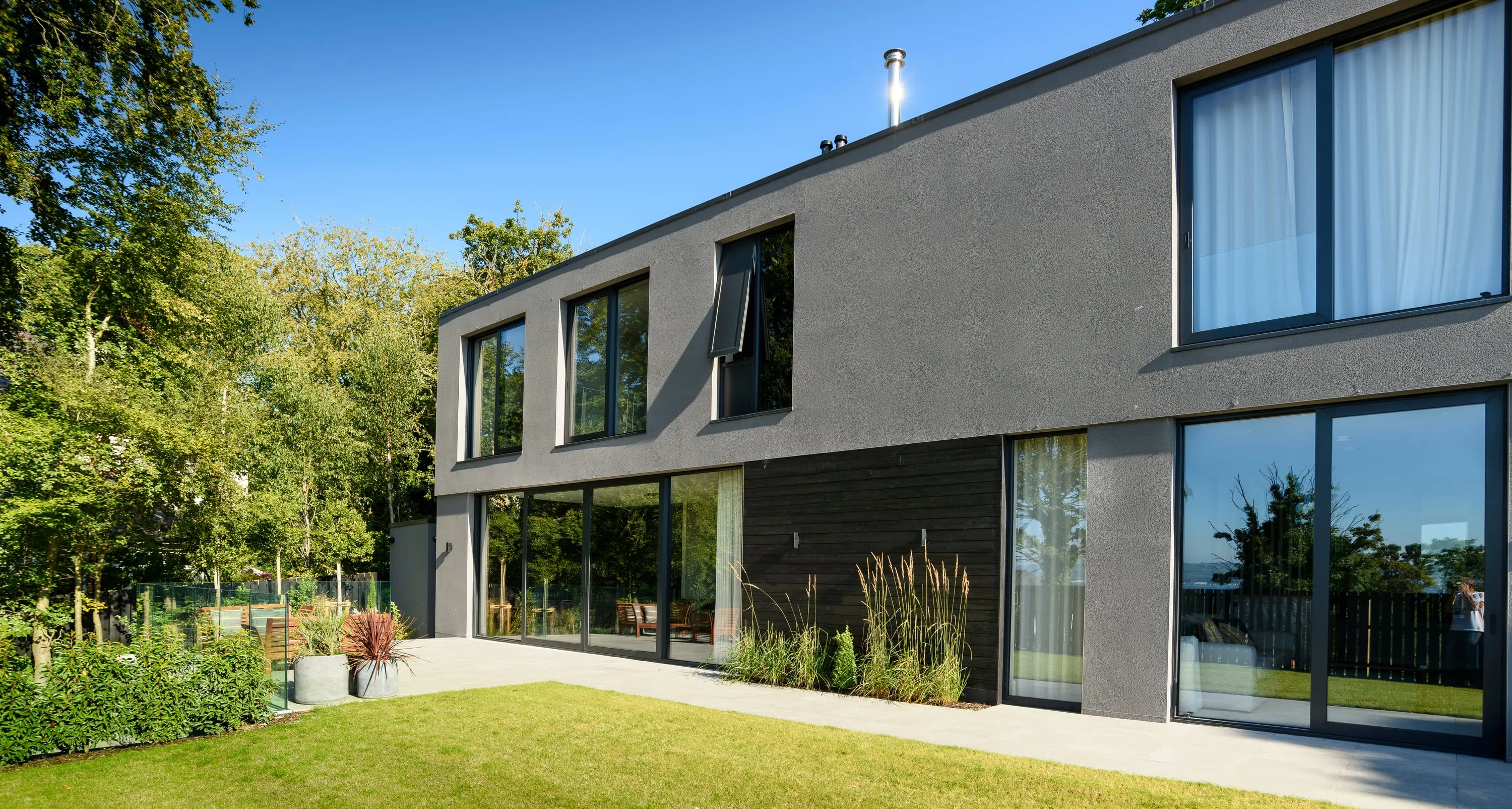 Rear elevation and lawn in summer
