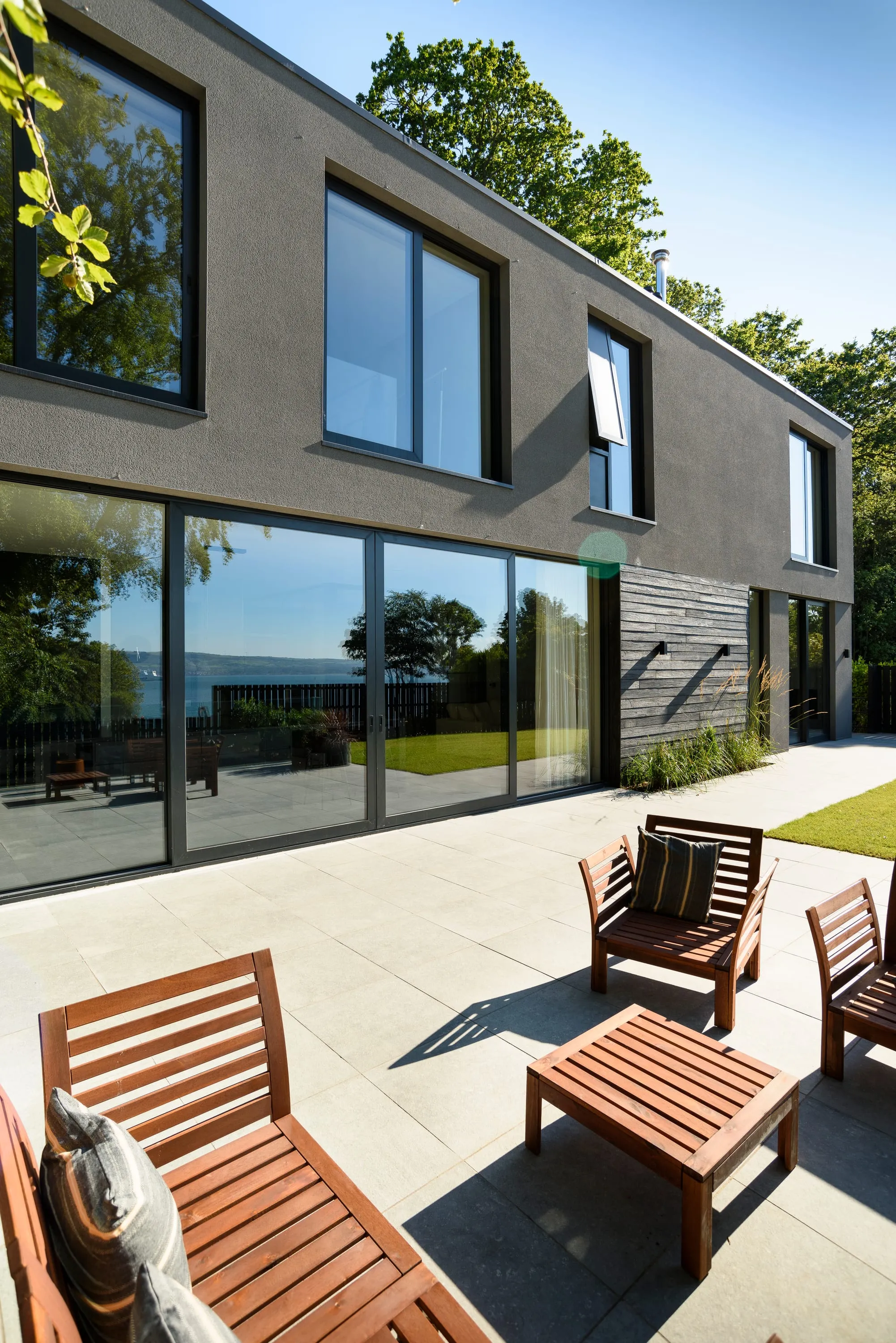 Outdoor seating on the terrace by the sliding doors