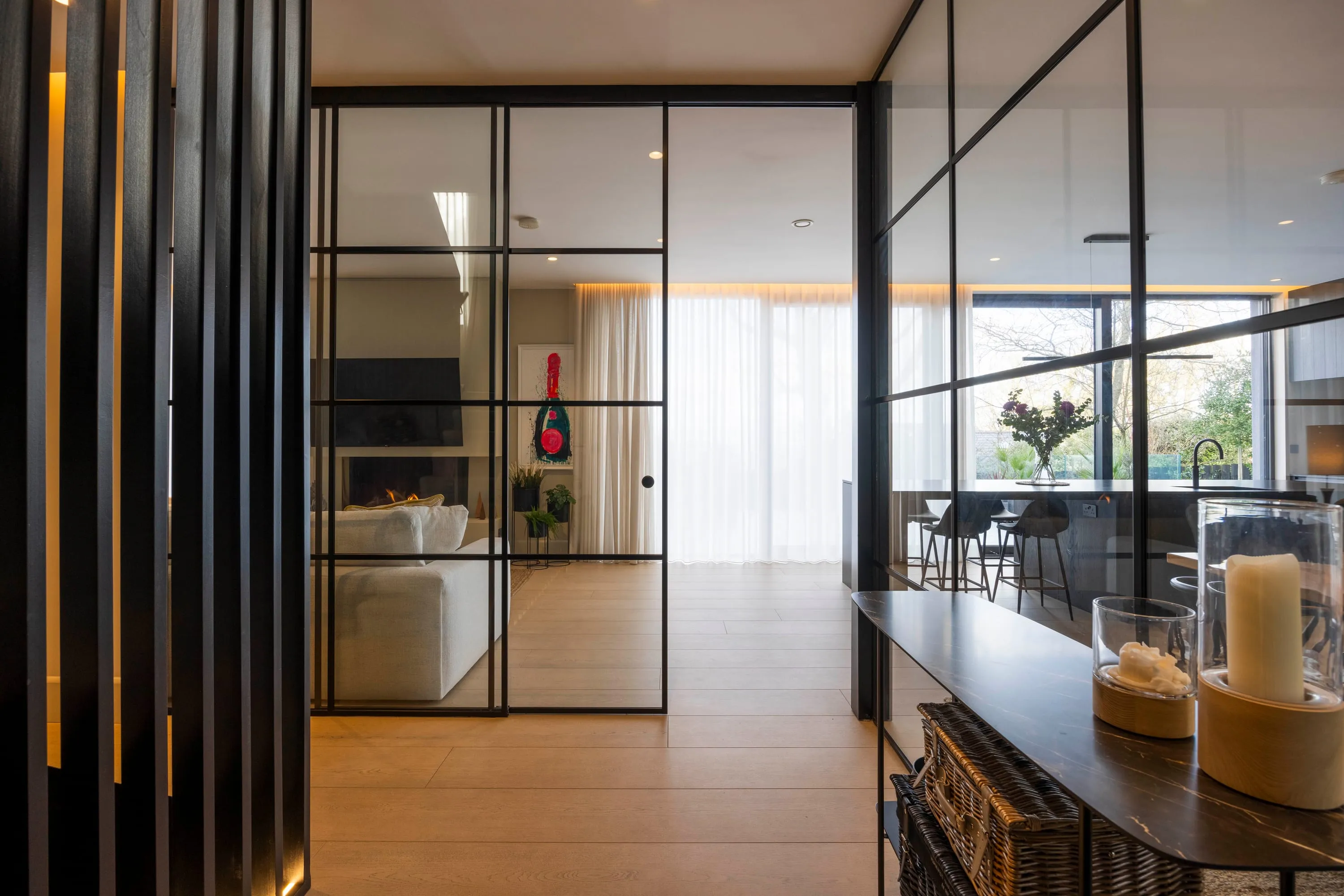Entrance hall seen through the Crittall-style glazed screen
