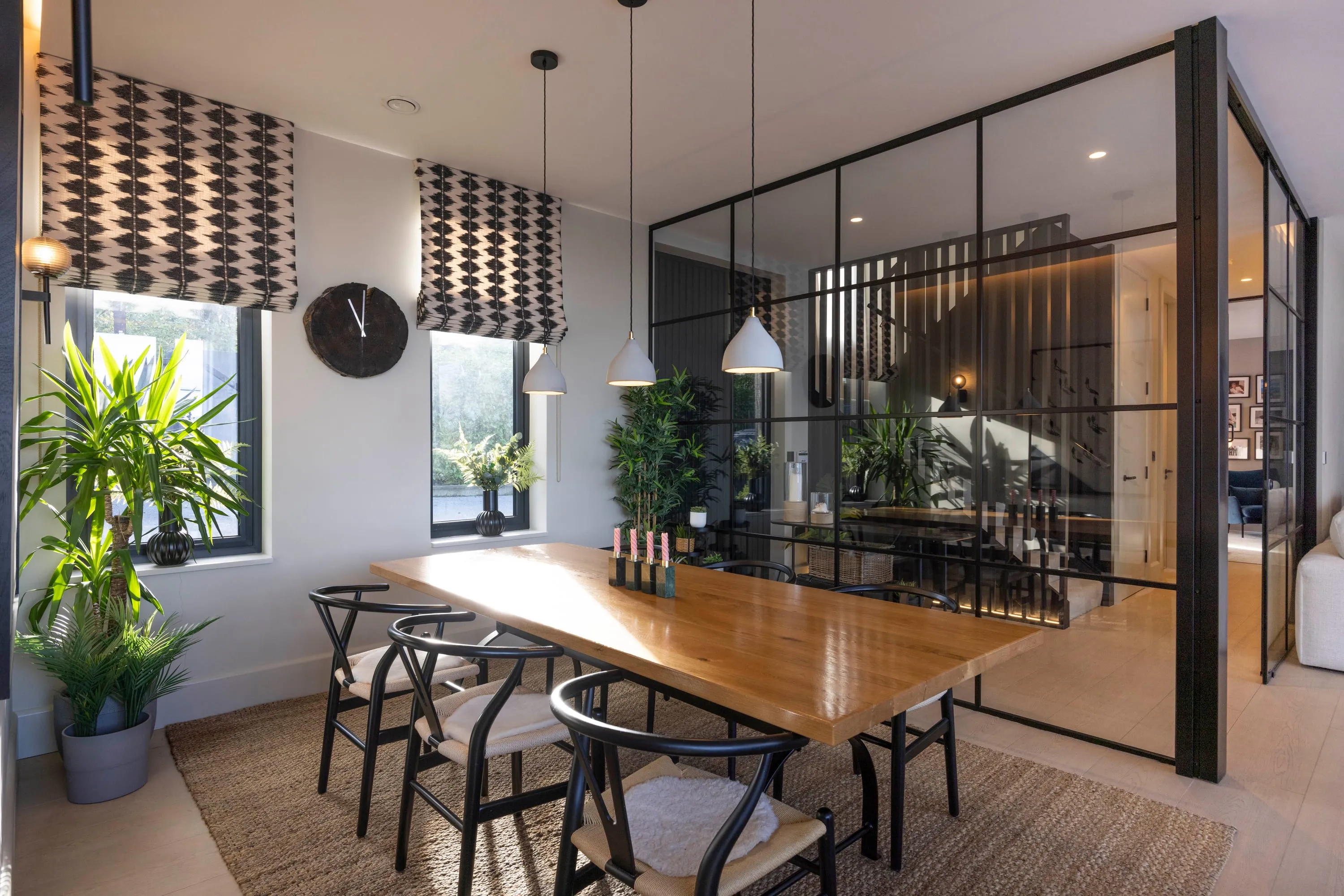 Dining table with the glazed screen and plants