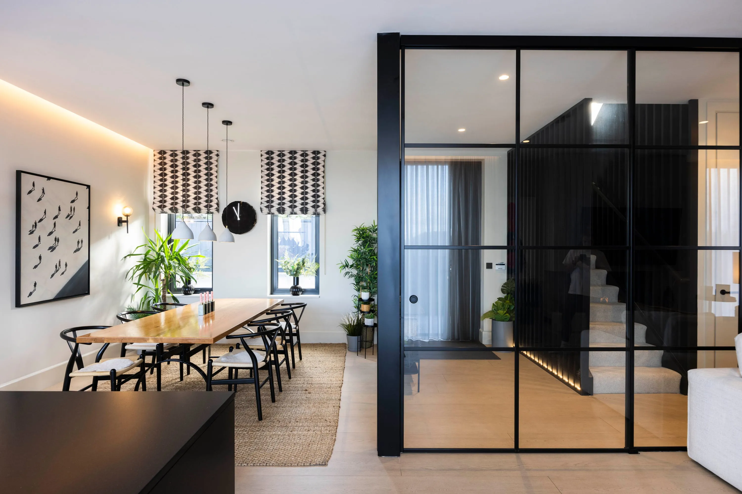 Dining area with the staircase screen and pendant lights