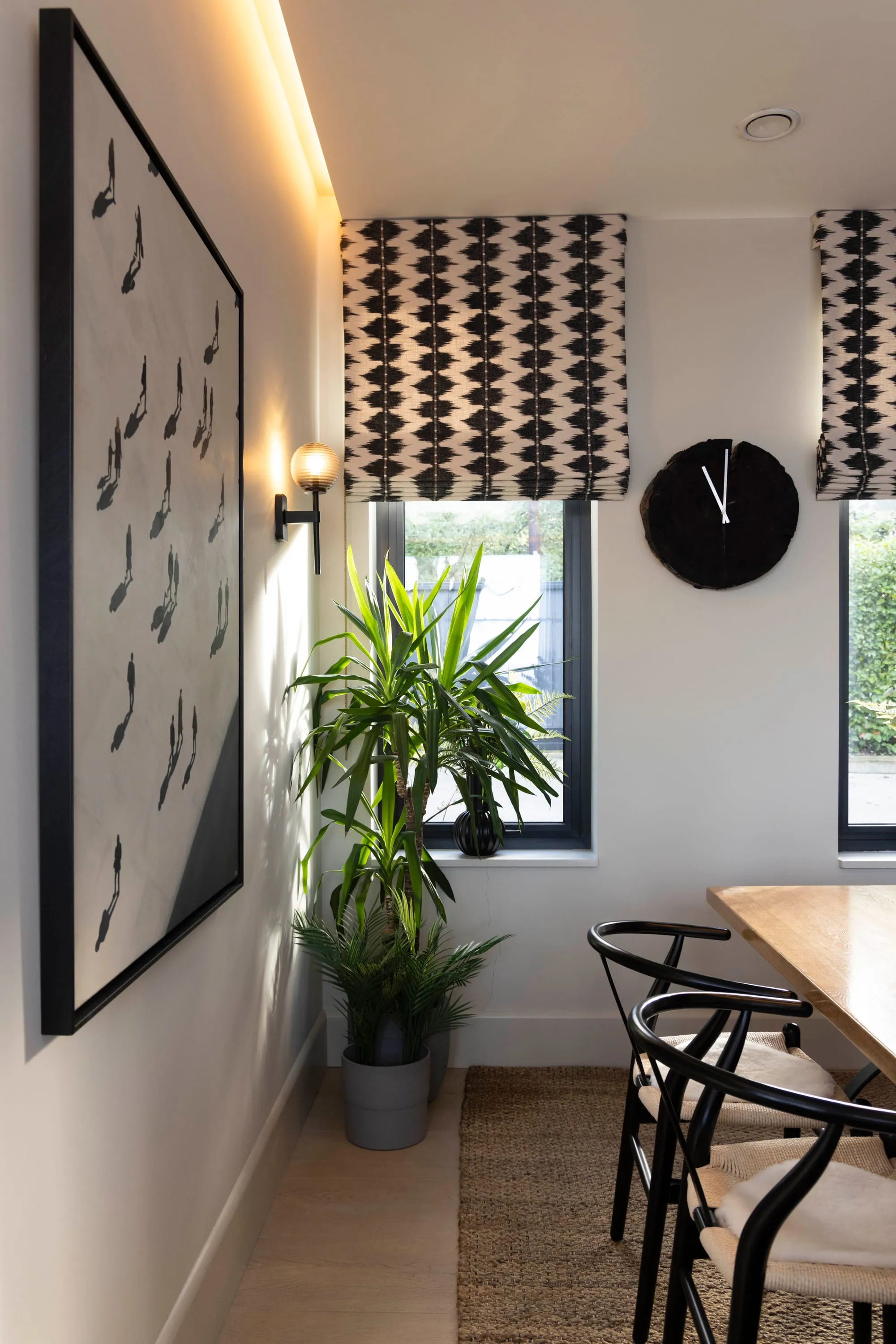 Dining area with artwork and clock