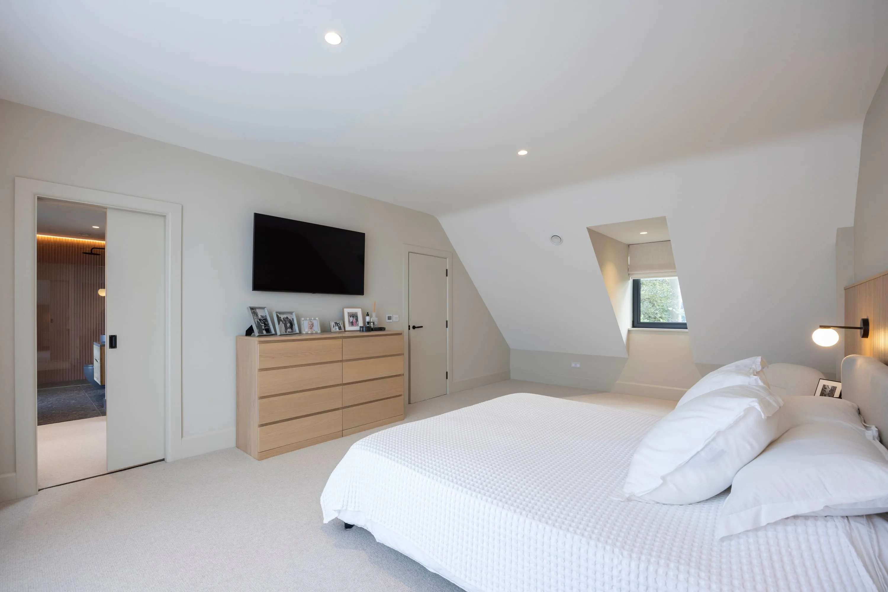Principal bedroom with dormer window and television