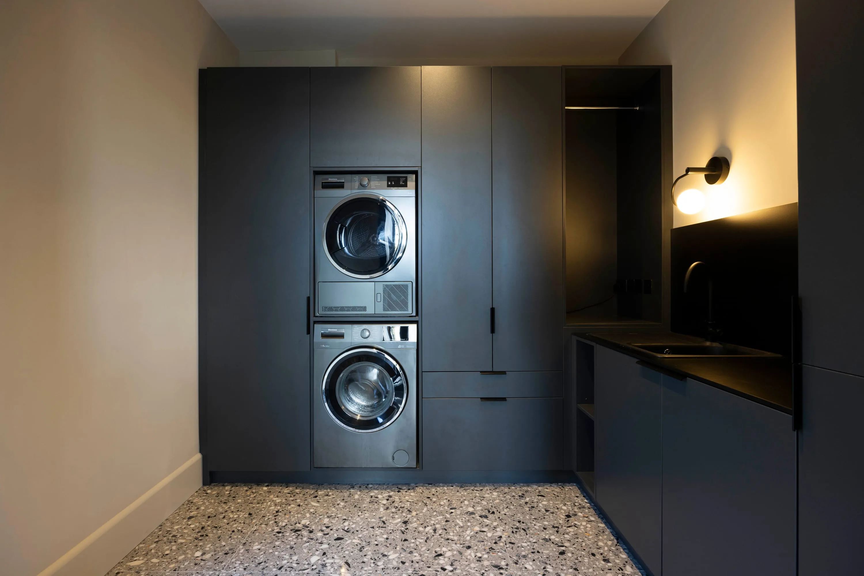 Utility room with terrazzo floor