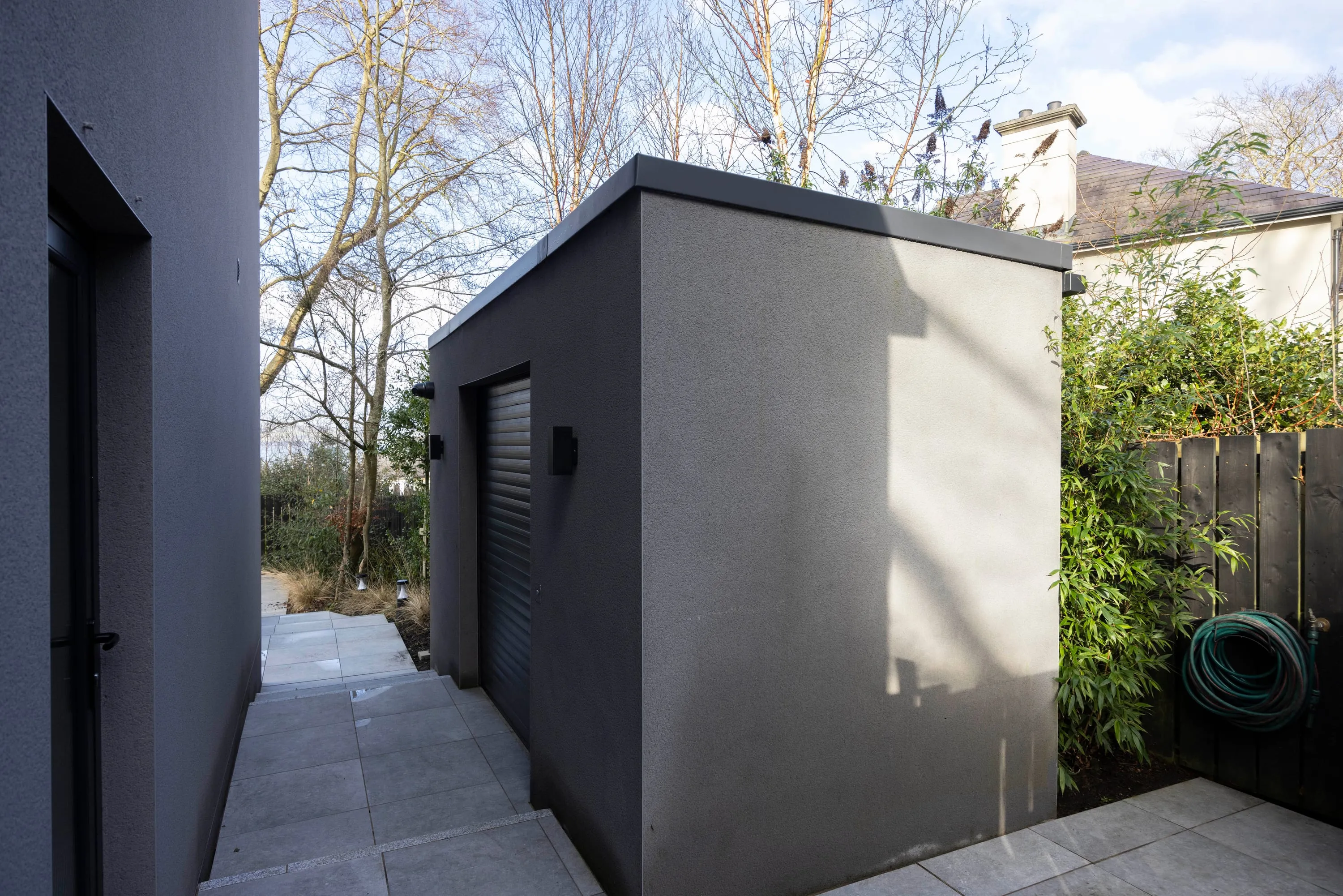 Garden store with roller shutter door